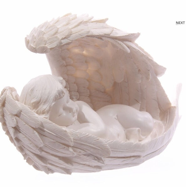 Angel cherub sleeping in wings