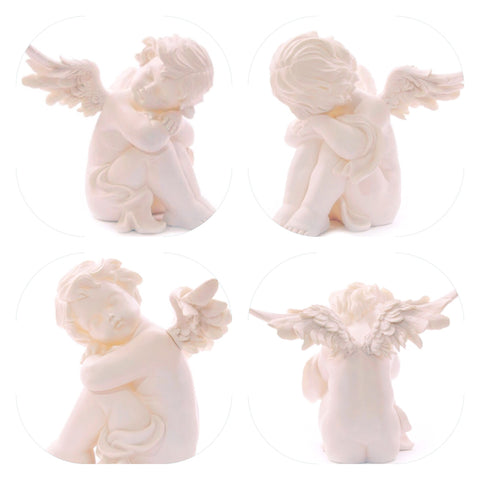 Angel cherub  sitting head on knee's